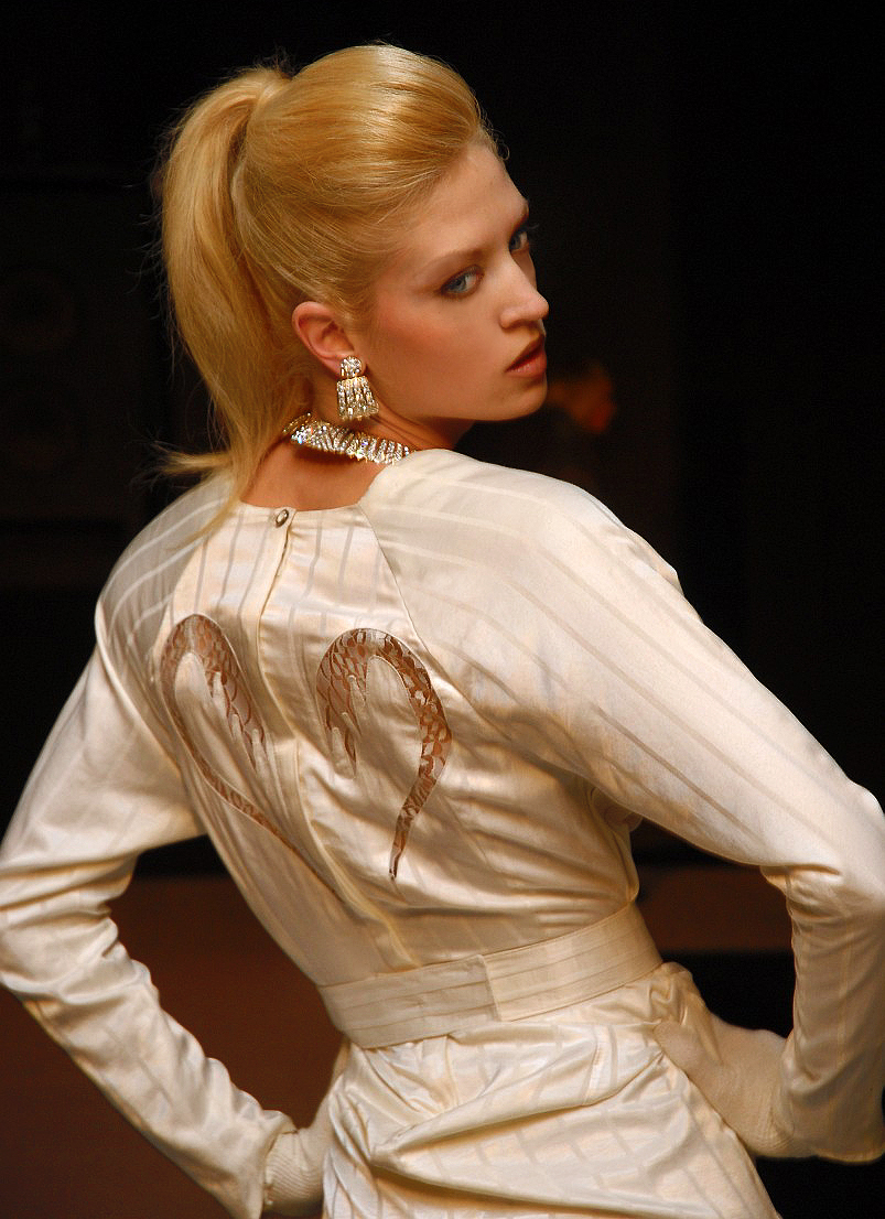 Top runway model Vera Gafron poses in a white cocktail dress of modern Templar with french lace embedded application from exquisite silk by the German fashion designer Torsten Amft. From the Fall / Winter 2008 - 2009 trend collection to the Berlin fashionweek. photography: M. Wittig