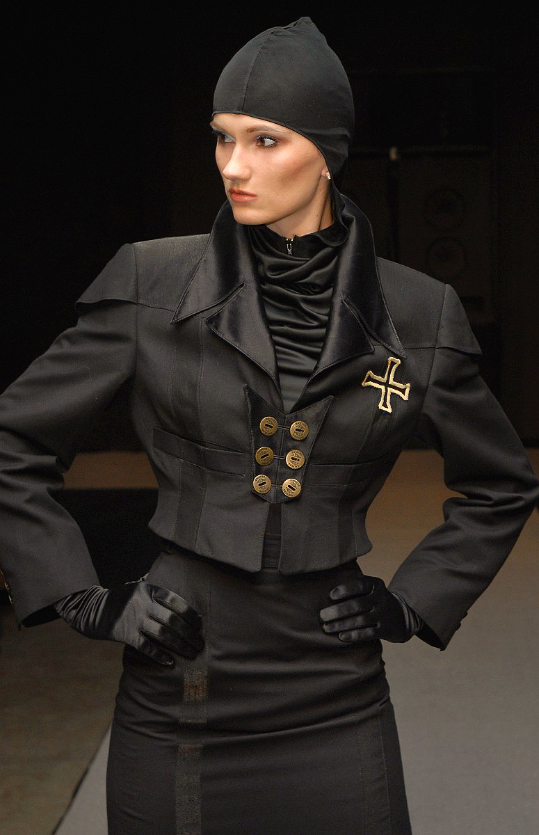 Black avant-garde costume in noble silk with progressive cut from german fashion designer Torsten Amft`s fall / winter 2008 - 2009 trend collection during the Berlin Fashion Week - fashion model on the runway is Franziska Scheffer - photographer: M. Wittig